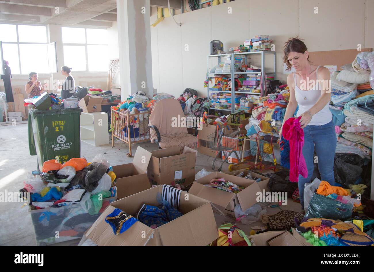 volunteers of Soup for Lewinski Organization gathering clothes for refugees in Tel Aviv pictured 21.02.2014 Stock Photo