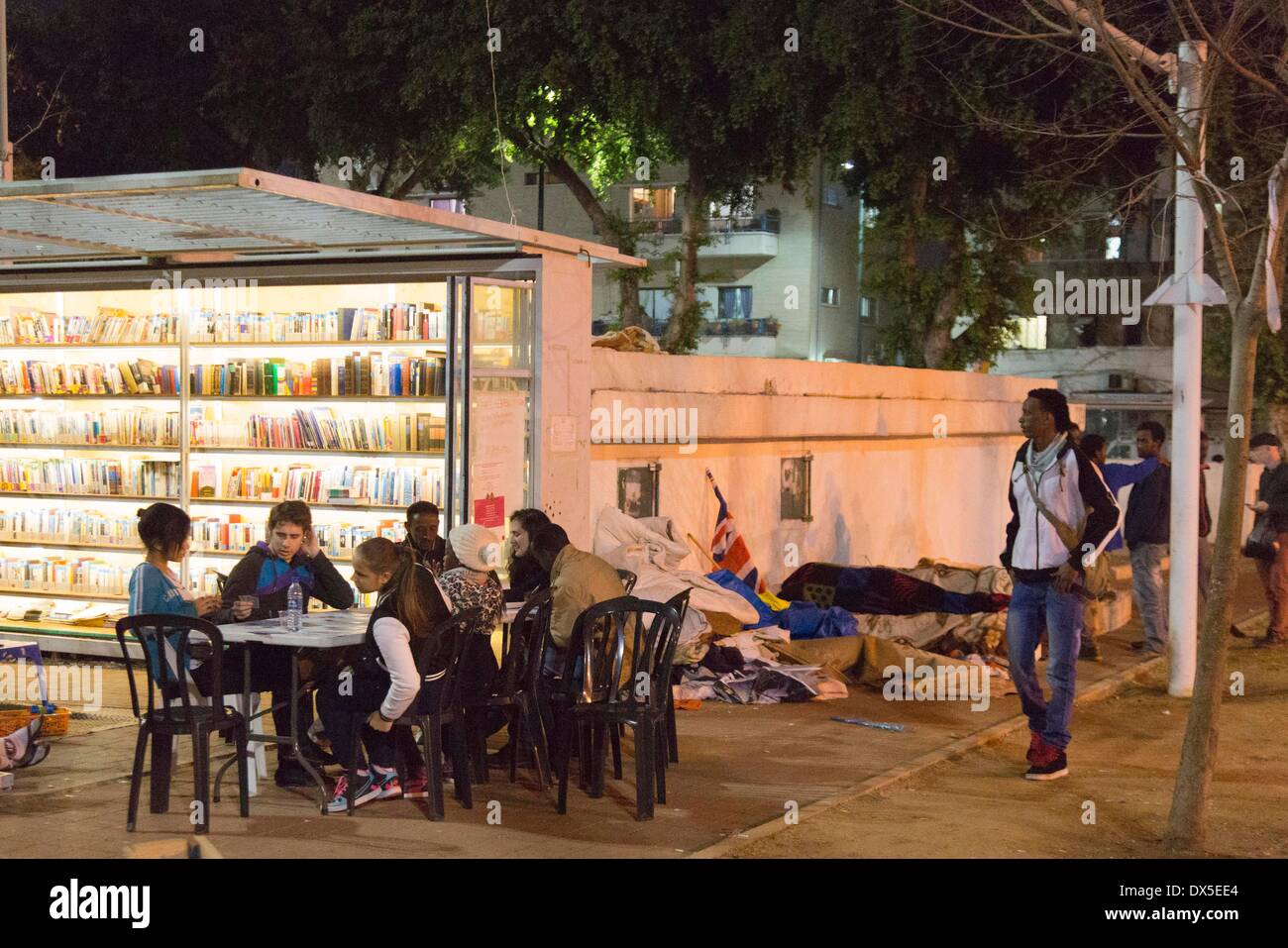 volunteers are running a library for refugees in in Levinski Park in Tel Aviv pictured 21.02.2014 Stock Photo