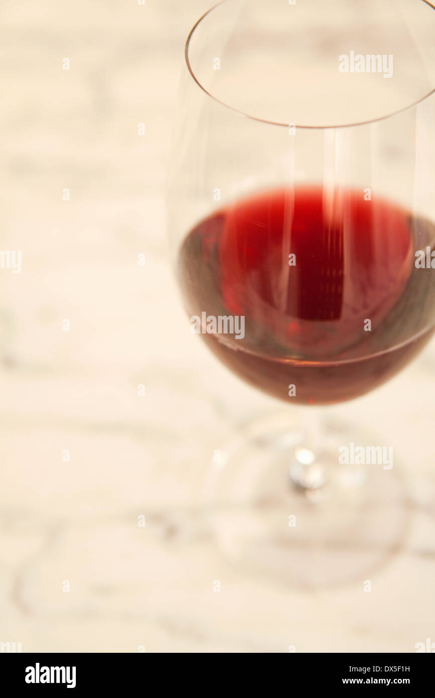 Red wine in wine glass on white background, high angle view, close up Stock Photo