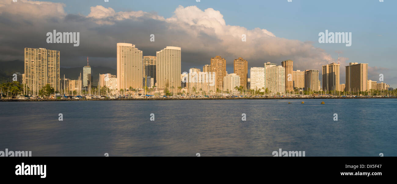 Honolulu and Waikiki skyline from Ala Moana park, Hawaii, USA at sunset Stock Photo