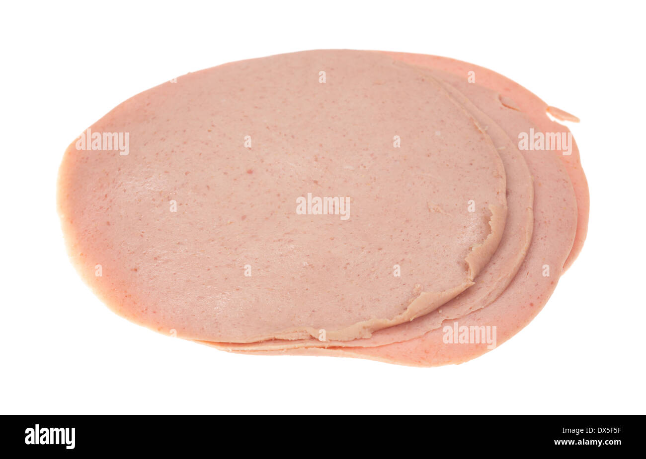 Several thin slices of German baloney on a white background. Stock Photo