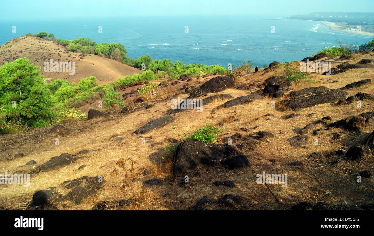 Exploring Goa India Scenic rocky cliff View and Aerial views of Goa Beach at North Goa India Stock Photo