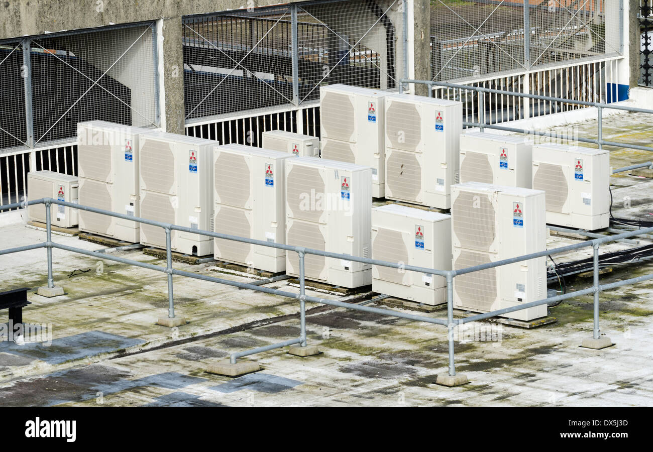 Air conditioning units on a rooftop of a large building. Stock Photo