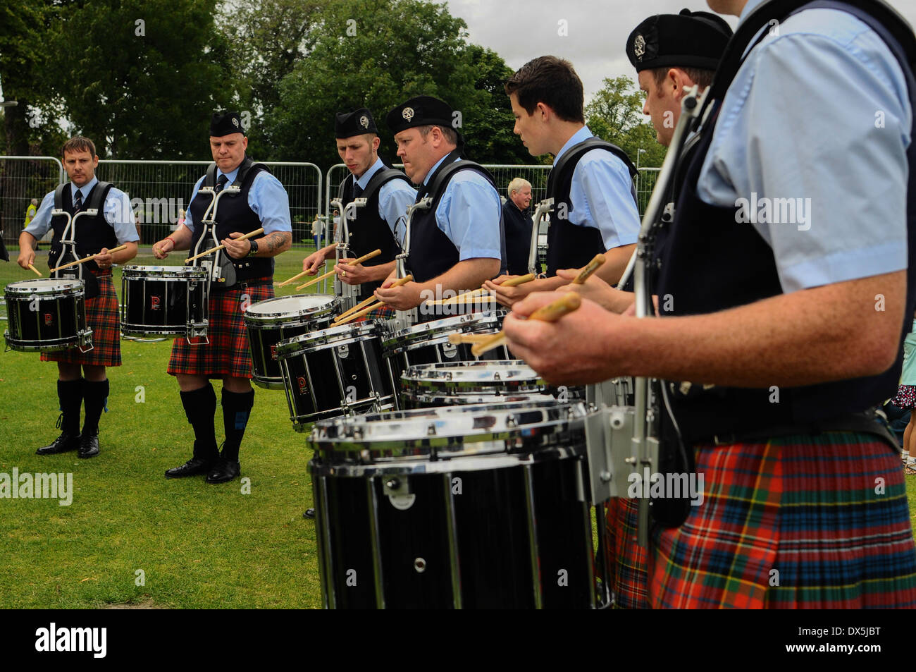 Pipe band competing at a Scottish Highland pipe band competition. The