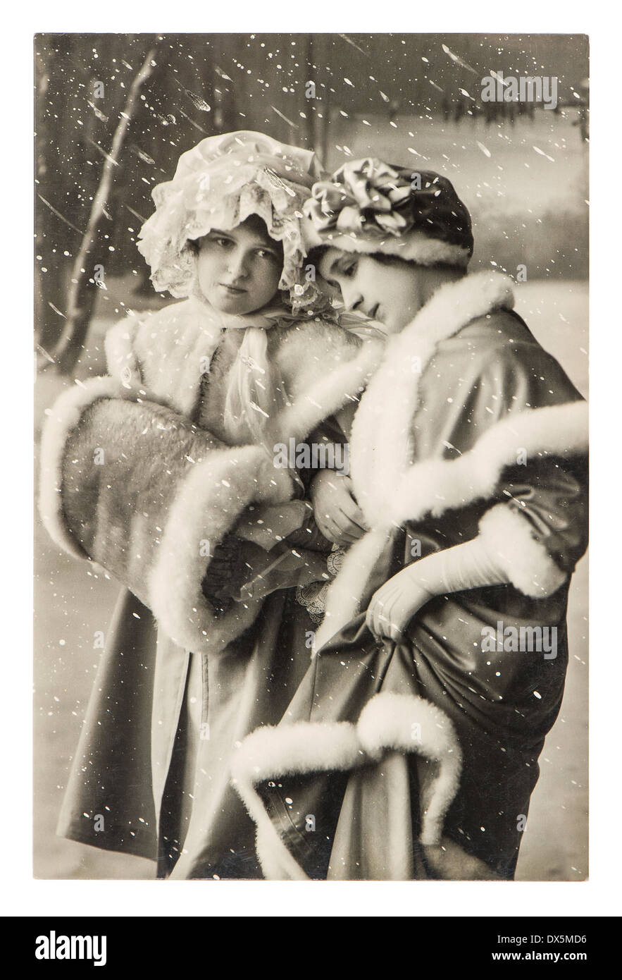 BERLIN, GERMANY CIRCA 1910 two young girls in vintage winter clothing. retro picture ca. 1910