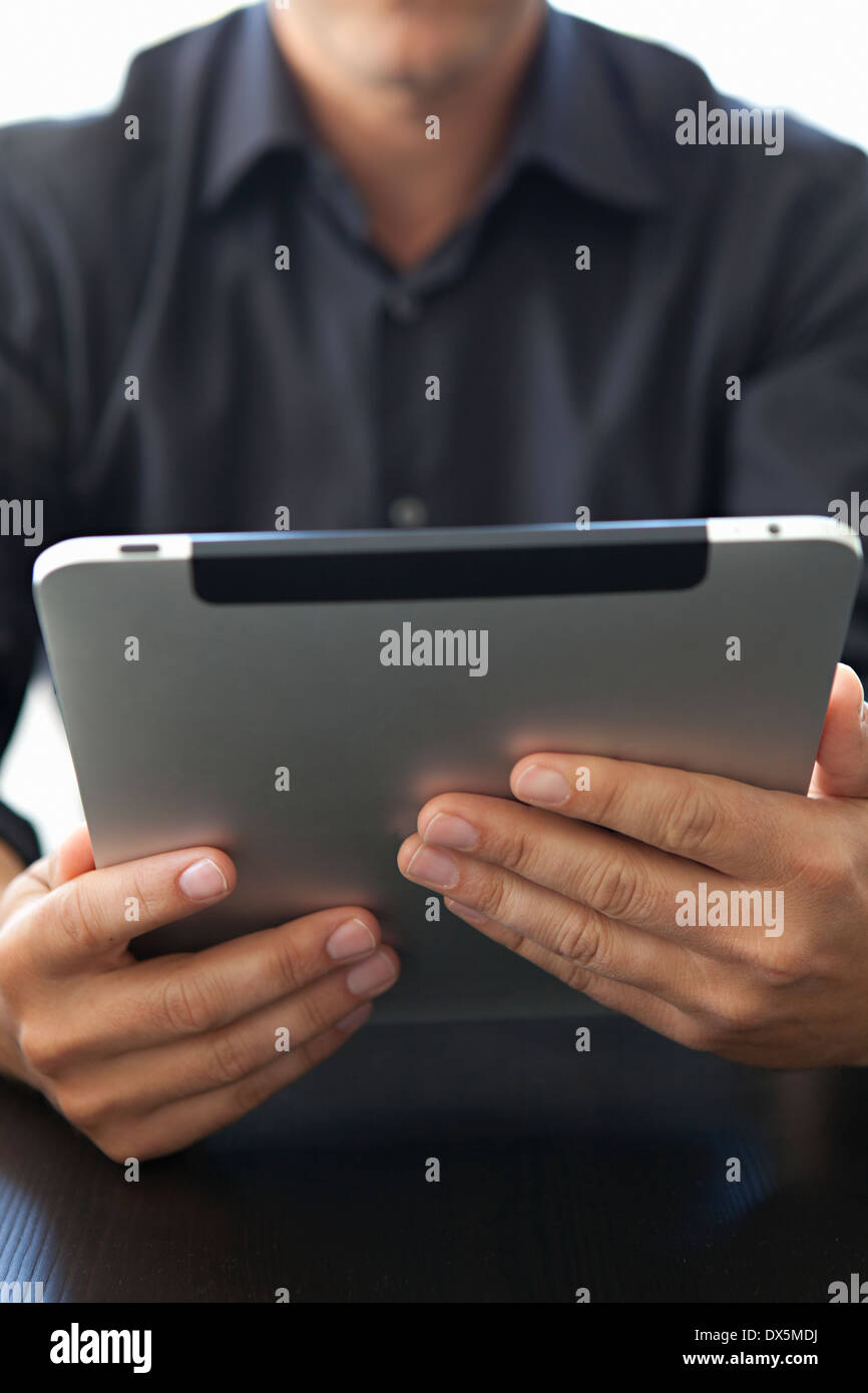 Man holding digital tablet, close up Stock Photo