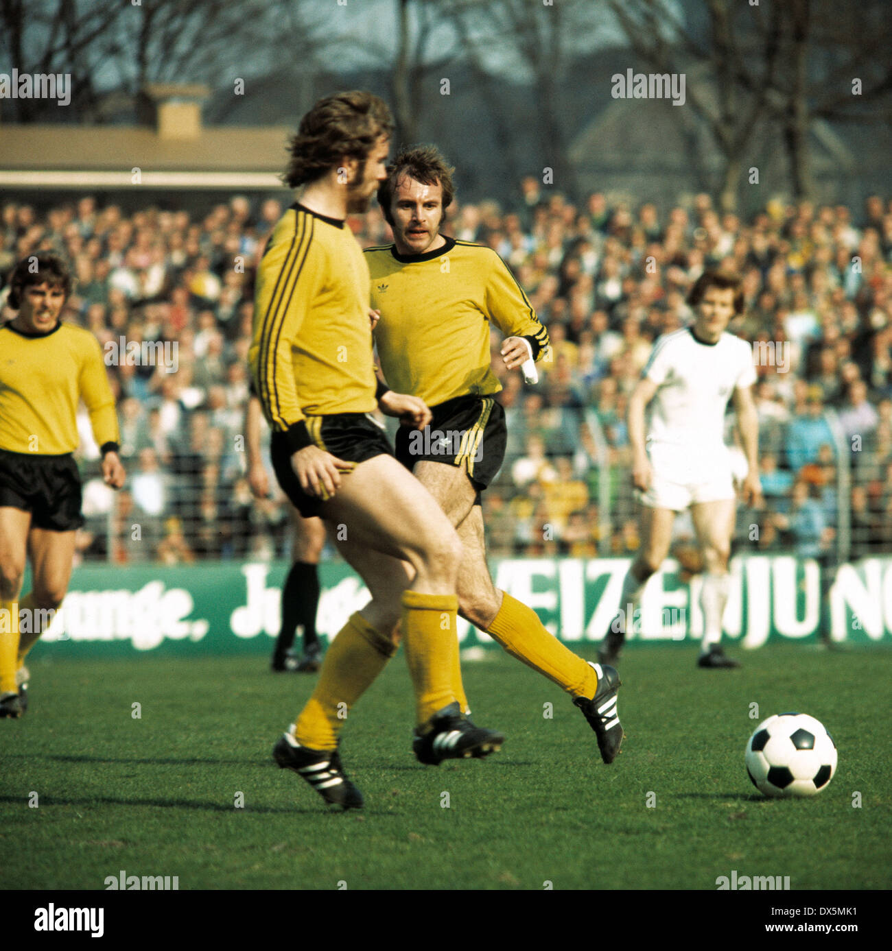 football, 2. Bundesliga Nord, 1975/1976, Lohrheide Stadium, SG Wattenscheid 09 versus Borussia Dortmund 2:1, scene of the match, f.l.t.r. Egwin Wolf (BVB), Ernst Savkovic (BVB), Hans-Werner Hartl (BVB), Ewald Hammes (09) Stock Photo