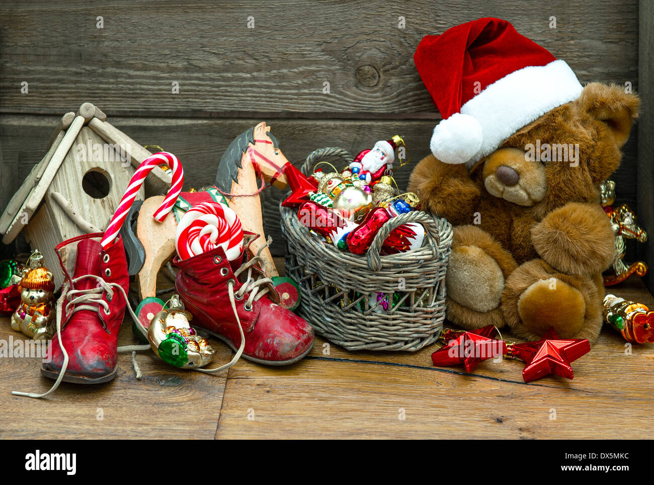 nostalgic christmas decoration with antique toys over wooden background. retro style picture Stock Photo