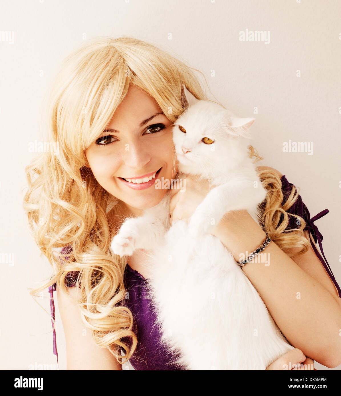 Girl holding cats Stock Photo Alamy