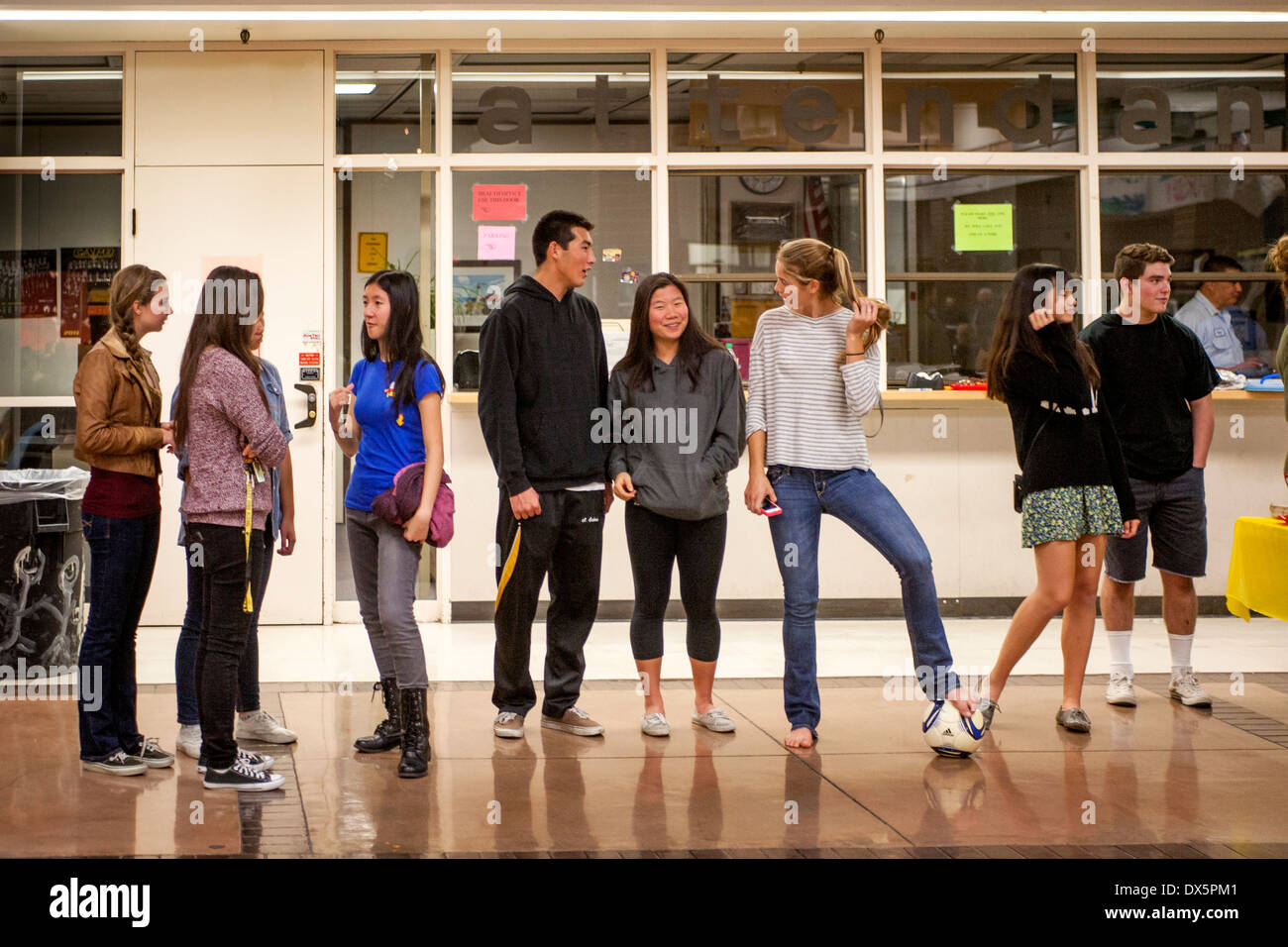 Multiracial high school students converse on campus in Mission Viejo, CA. Stock Photo