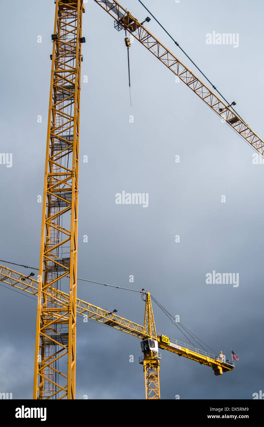 Tower cranes used in construction of high rise buildings.  Seattle Washington Stock Photo