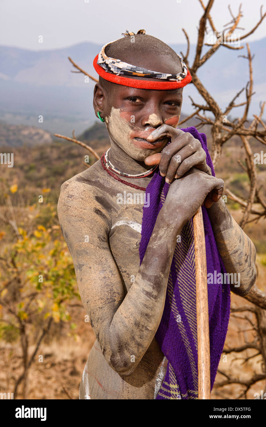 painted Mursi boy in Mago National Park, Lower Omo Valley of Ethiopia Stock Photo