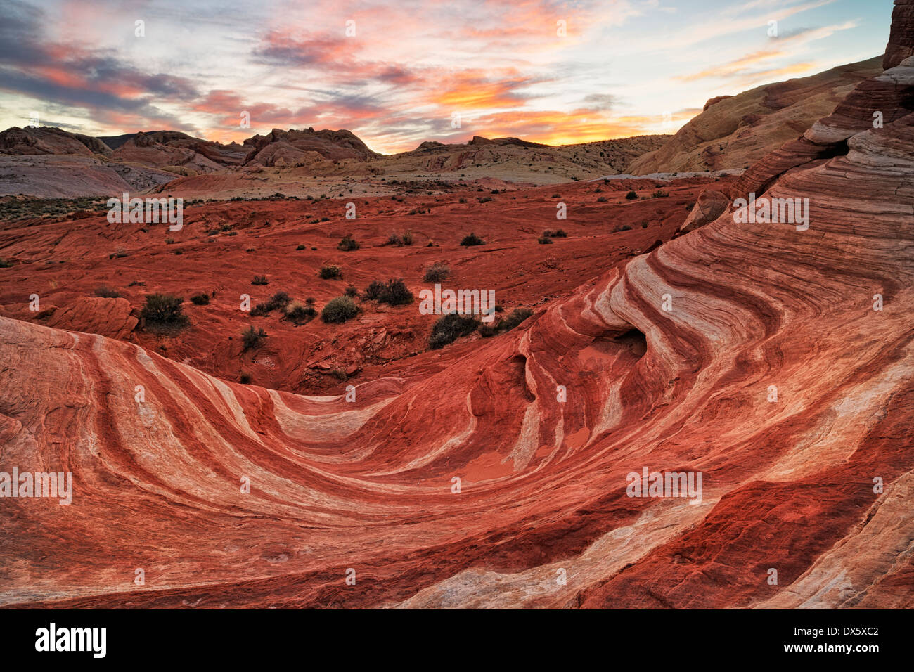 Sunset over the sandstone formation known as the Fire Wave in Nevada's Valley of Fire State Park. Stock Photo