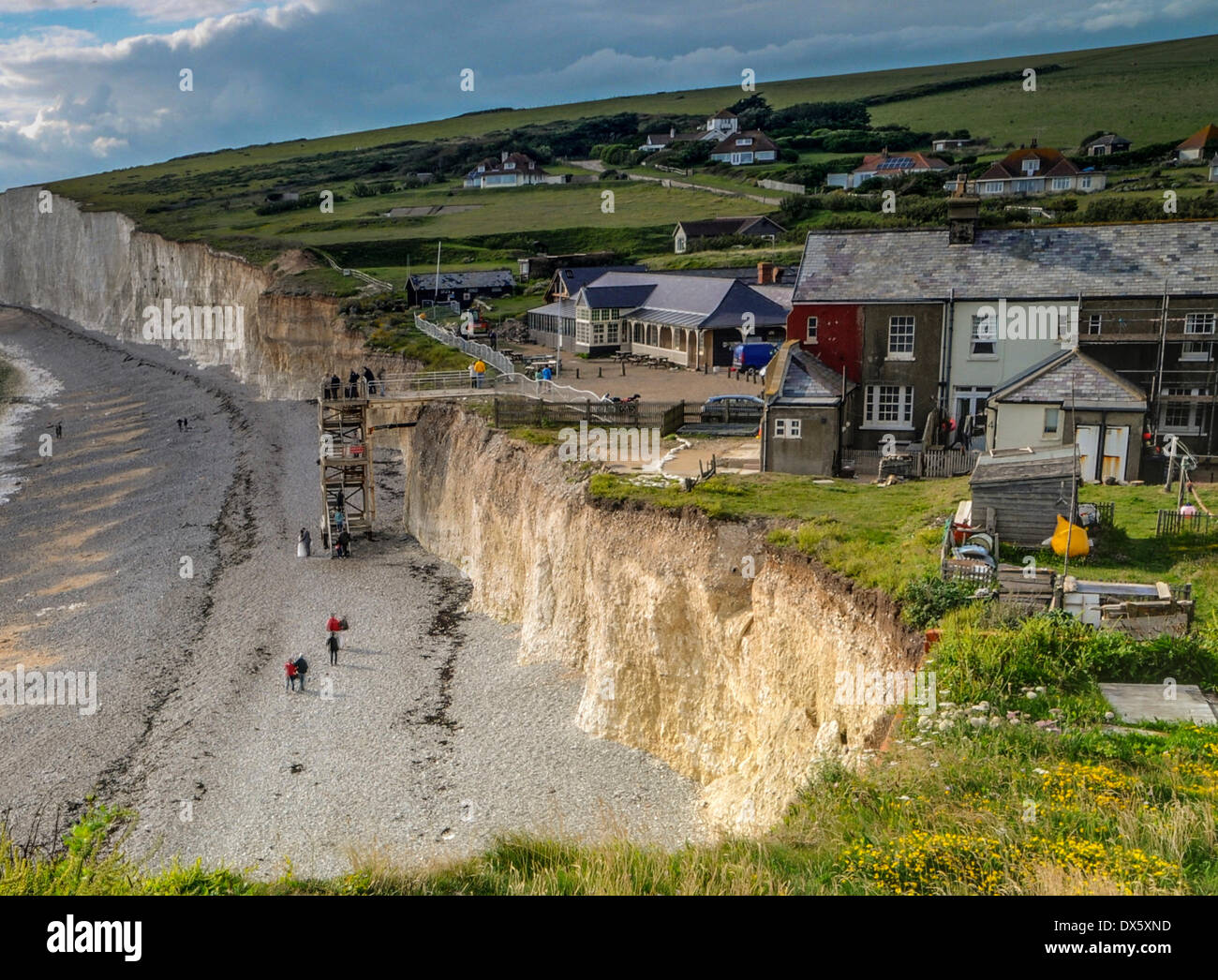 FILE PIX: 15th July 2012. Birling Gap, East Sussex 19 Months ago shows how much more land there was by the cottages, and how quickly the cliff has eroded compared to what it looks like today. Credit:  David Burr/Alamy Live News Stock Photo