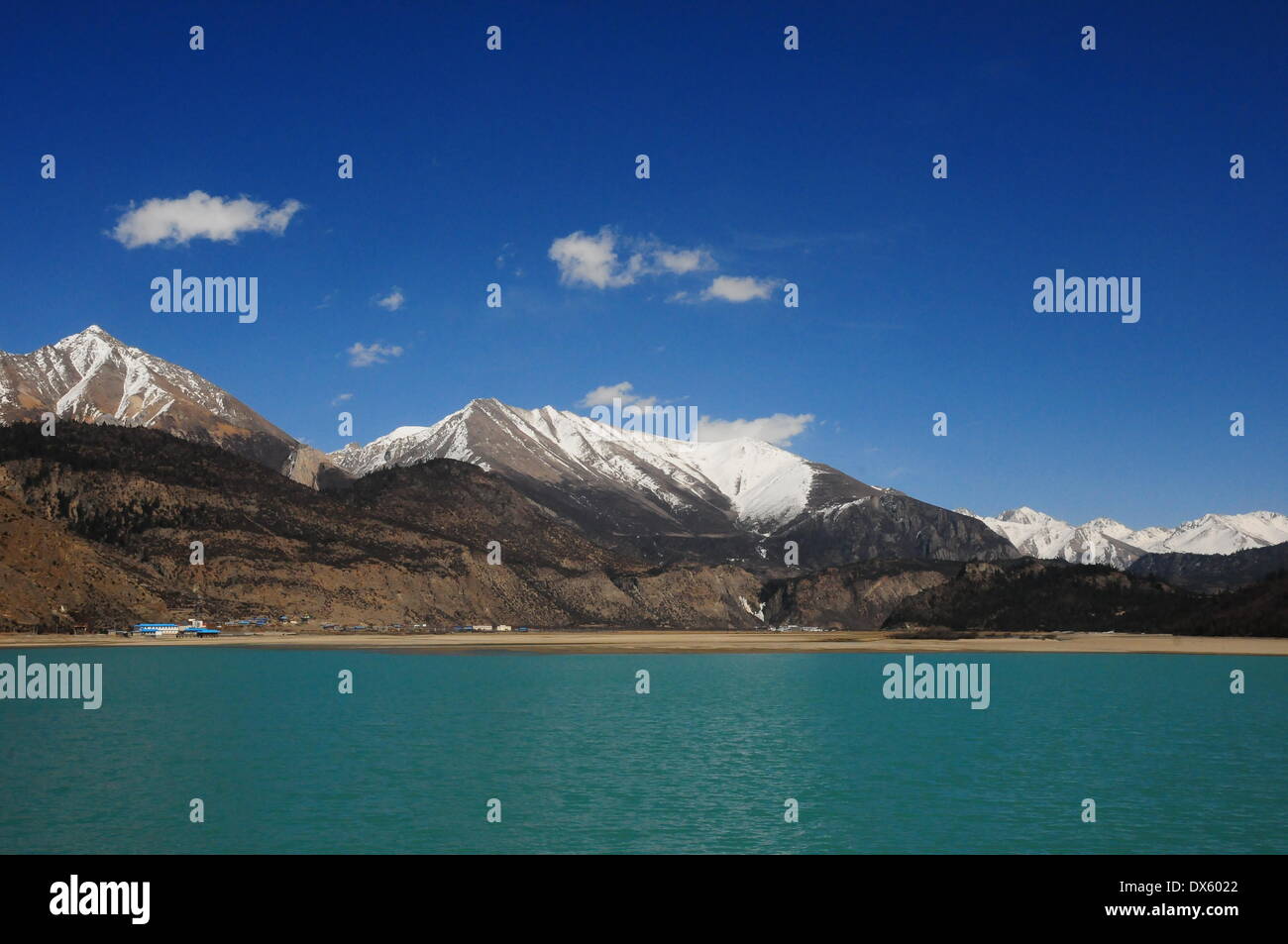Chamdo. 18th Mar, 2014. Photo taken on March 18, 2014 shows the scenery of the Ranwu Lake in Basu County, southwest China's Tibet Autonomous Region. The Ranwu Lake stands at an altitude of 3,850 meters with an acreage of 22 square kilometers. © Wang Shoubao/Xinhua/Alamy Live News Stock Photo