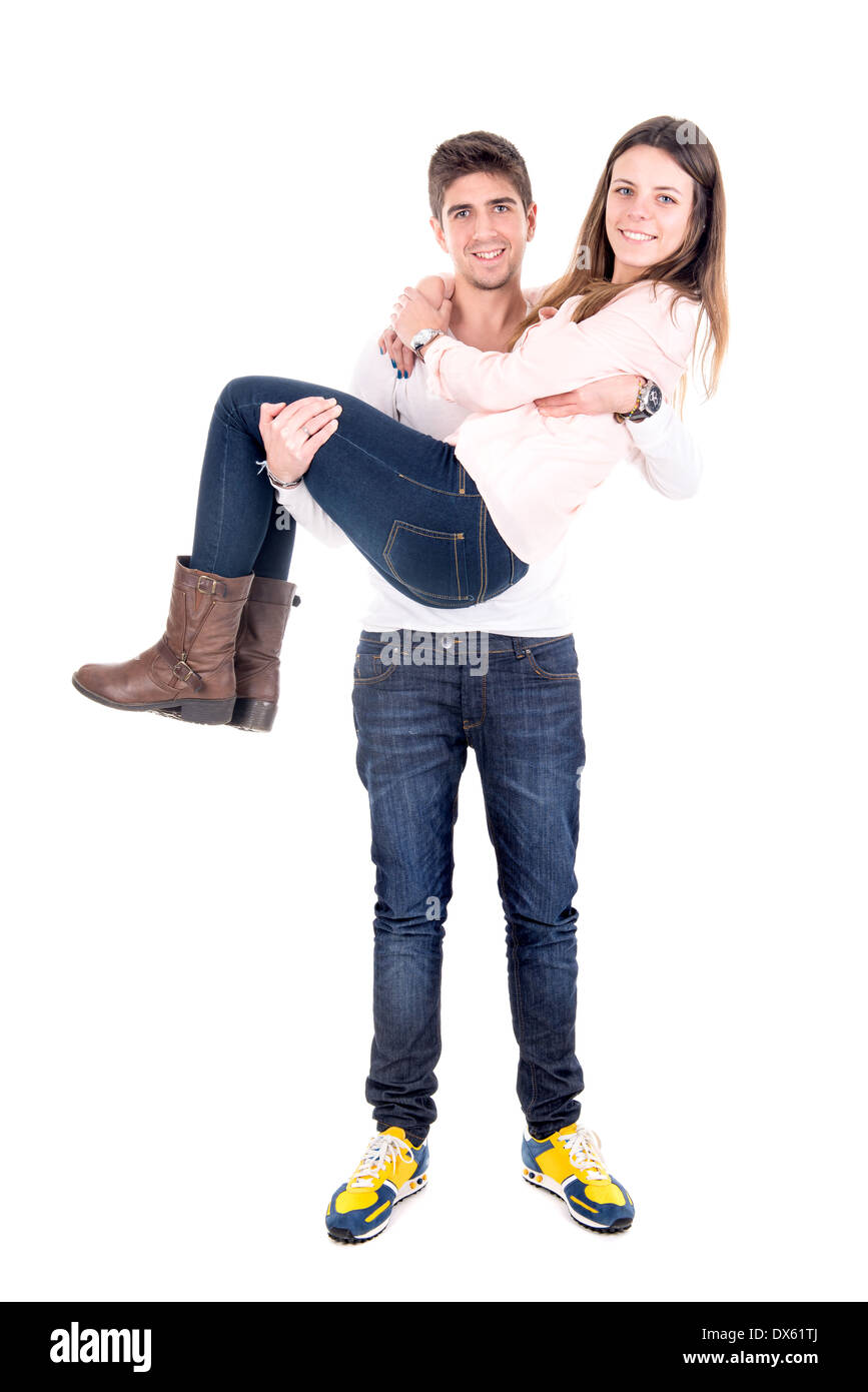 Young man carrying girlfriend isolated in white Stock Photo