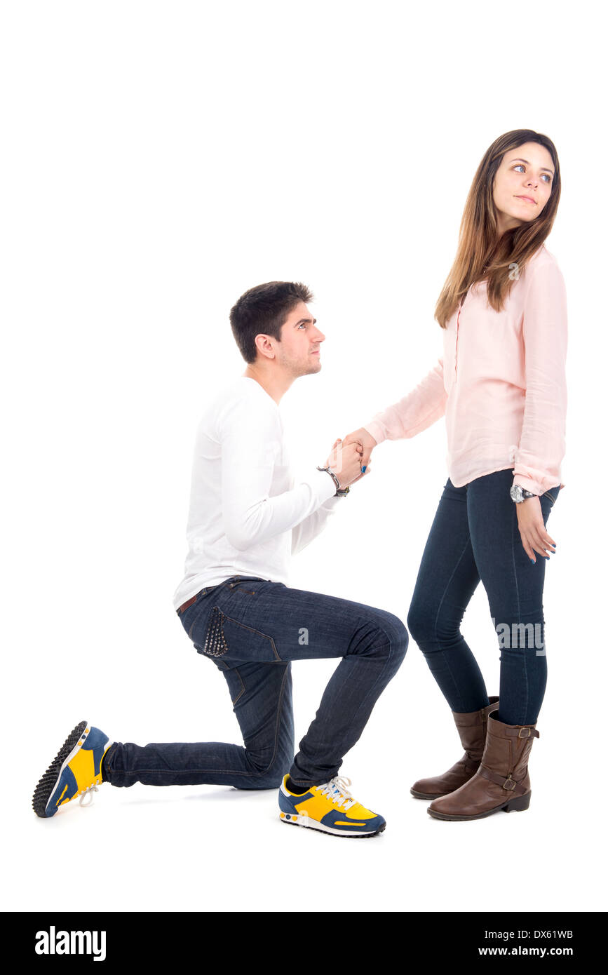 Young man proposing to his girlfriend Stock Photo