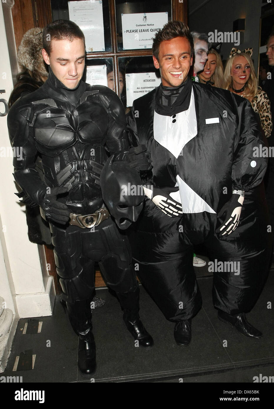 Liam Payne of One Direction dressed as Batman and Tom Daley in a fat skeleton costume Celebrities at Funky Buddha nightclub for a Halloween party London, England - 28.10.12 Where: London, United Kingdom When: 27 Oct 2012 Stock Photo