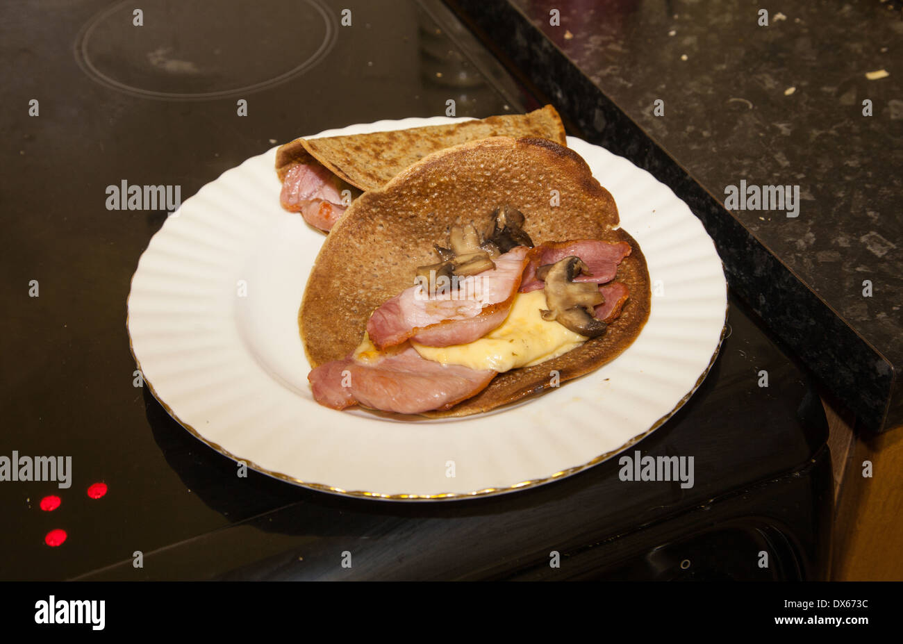 North Staffordshire Oatcakes, a regional savory delicacy,  filled with bacon cheese and mushrooms Stock Photo