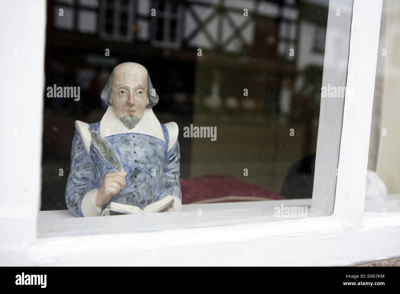 Porcelain bust of William Shakespear looking out of a window , Stratford upon Avon, Stock Photo