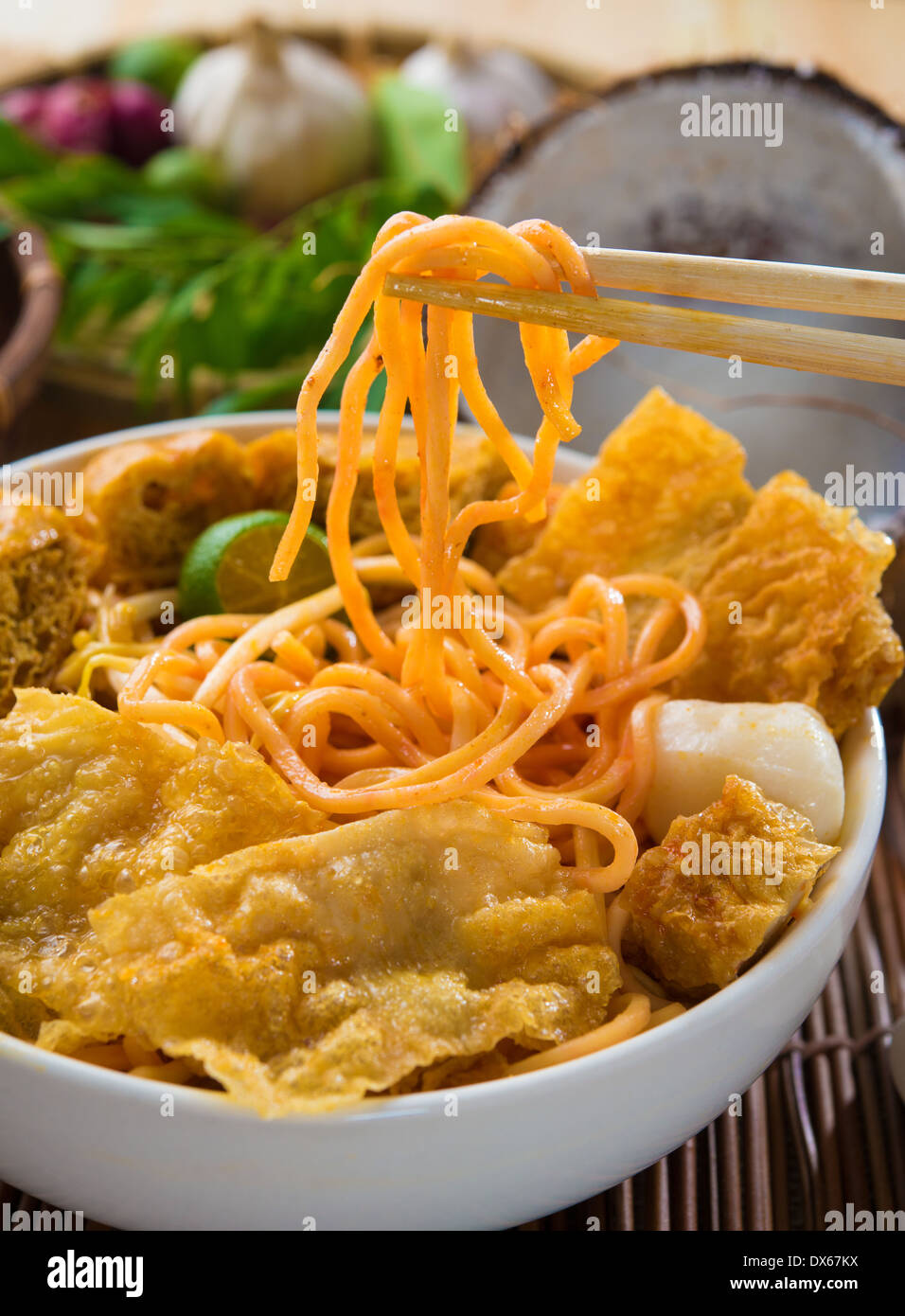 Curry Laksa which is a popular traditional spicy noodle soup from the Peranakan culture in Malaysia and Singapore Stock Photo