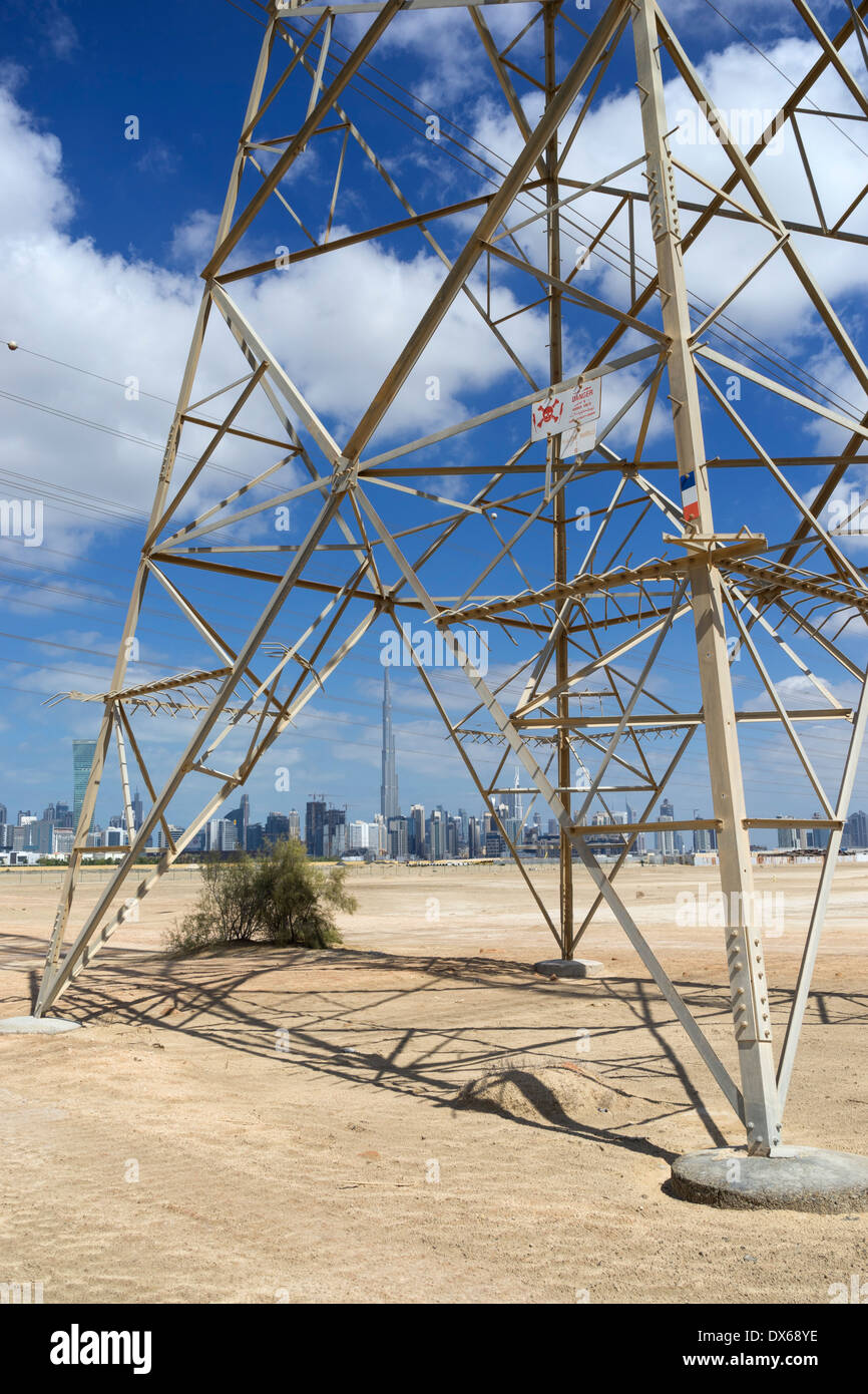 Skyline of Dubai with highvoltage electricity transmission pylons in