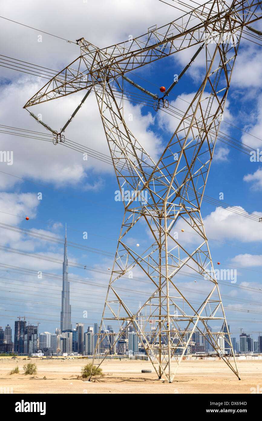 Skyline of Dubai with highvoltage electricity transmission pylons in