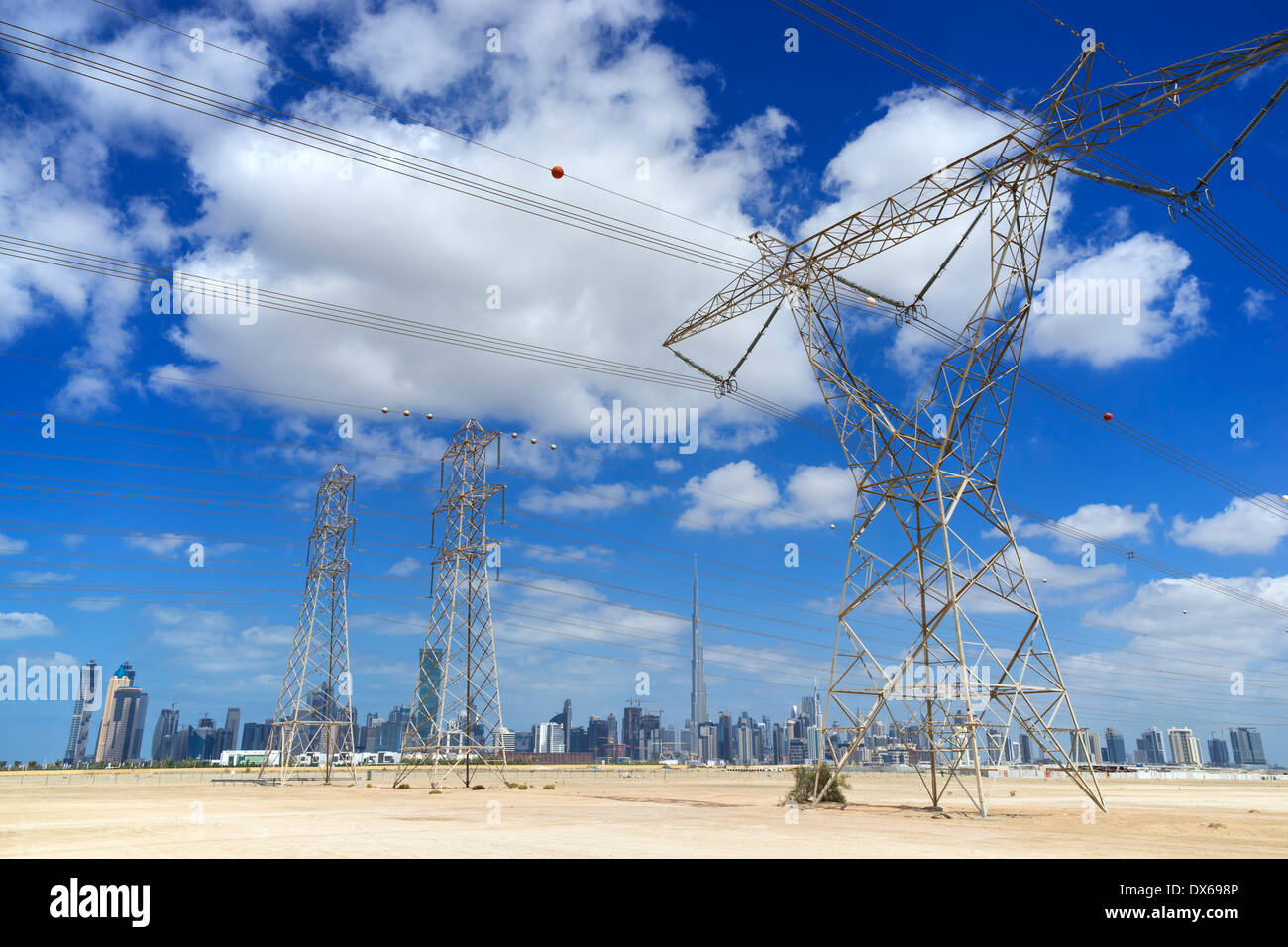 Skyline of Dubai with highvoltage electricity transmission pylons in