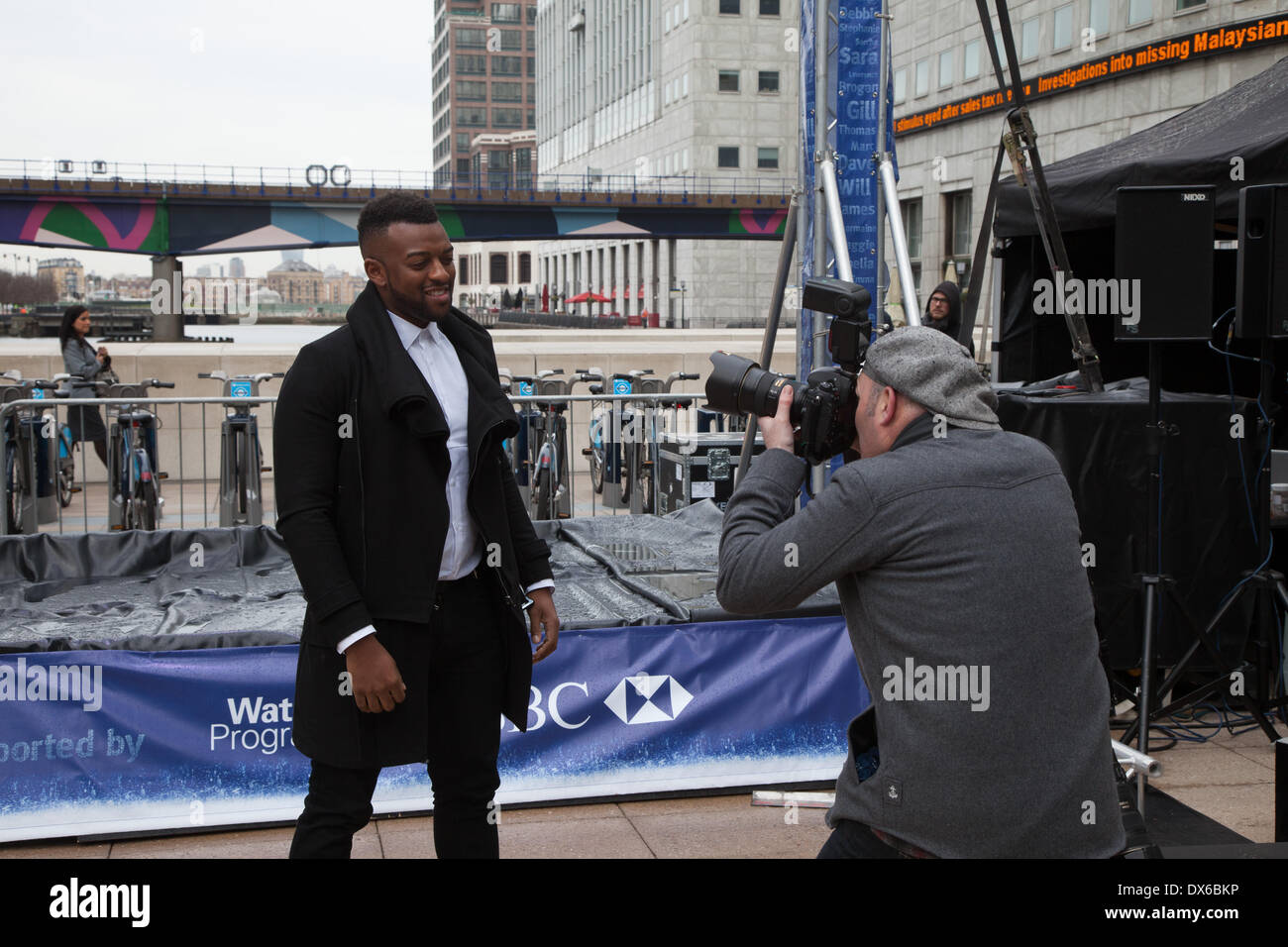 London, UK, 19th Mar, 2014. JLS star Oritsé Williams launches Water Aid's campaign by adding first 'watergraph' to pledge his support for World Water Day outside the Canary Wharf Tube station. Credit:  Steve Bright/Alamy Live News Stock Photo
