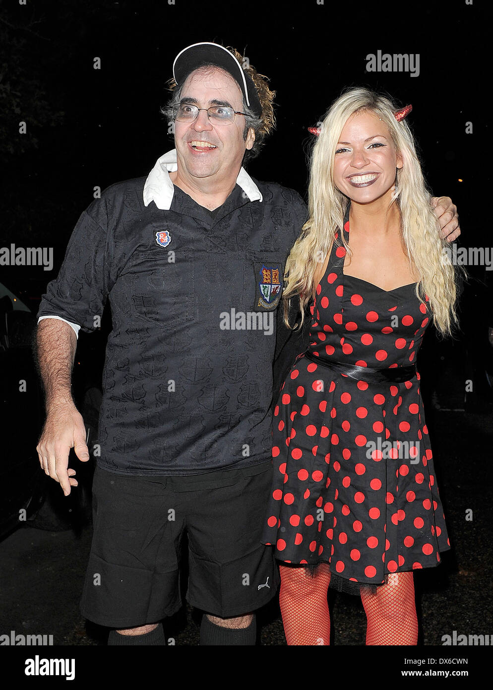 Danny Baker and his daughter leaving a Halloween party held at the home of television presenter