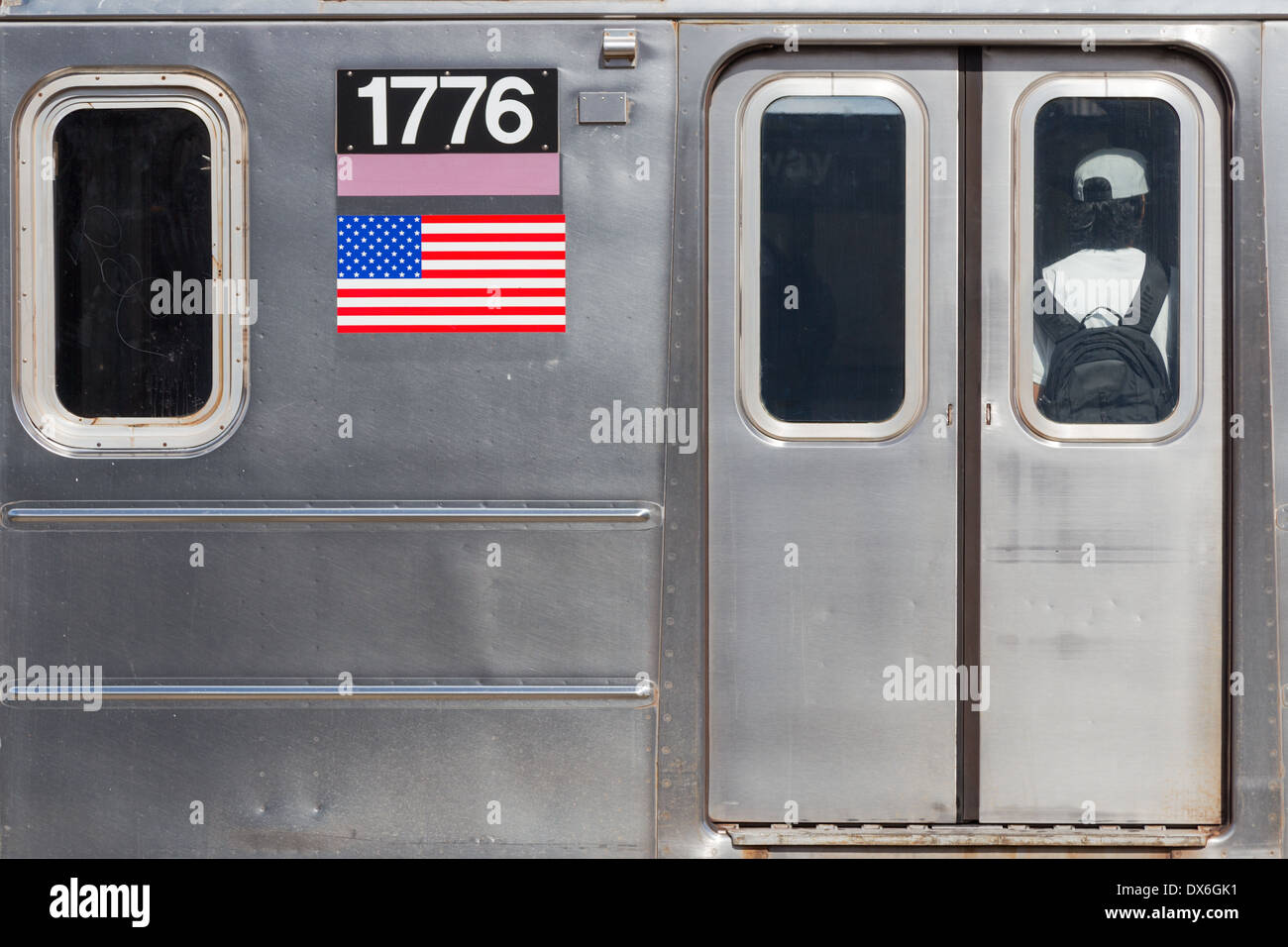 Street photo of detail on an NYC subway car that happens to have a very patriotic registration number: 1776. Stock Photo
