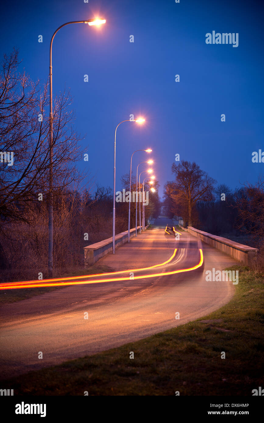 Road defocused light night tree hi-res stock photography and images - Alamy