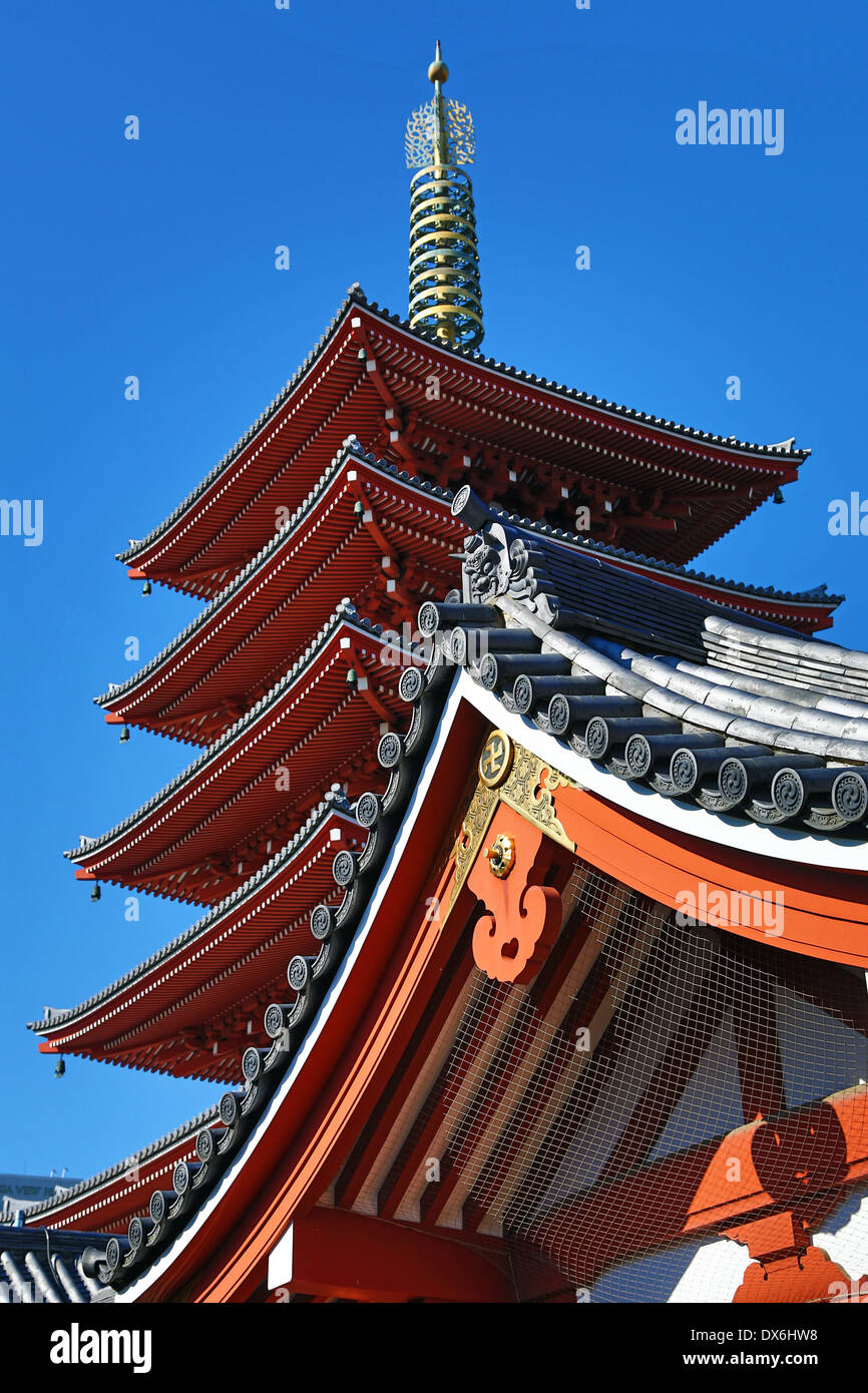 Traditional wooden roof and pagoda at the Shinto Shrine at Senso-Ji Buddhist Temple in Asakusa in Tokyo, Japan Stock Photo