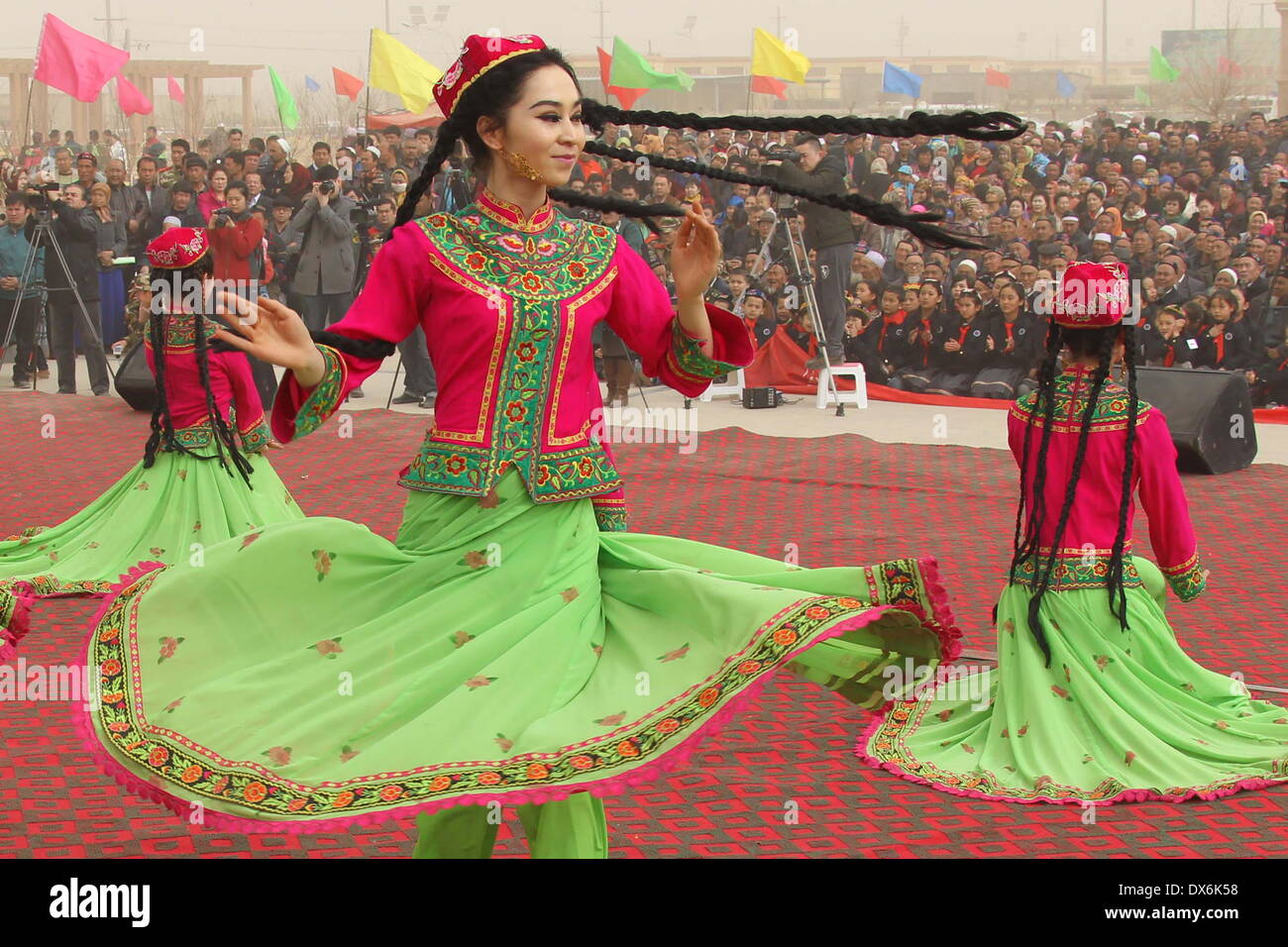 Hami, China's Xinjiang Uygur Autonomous Region. 19th Mar, 2014. Girls