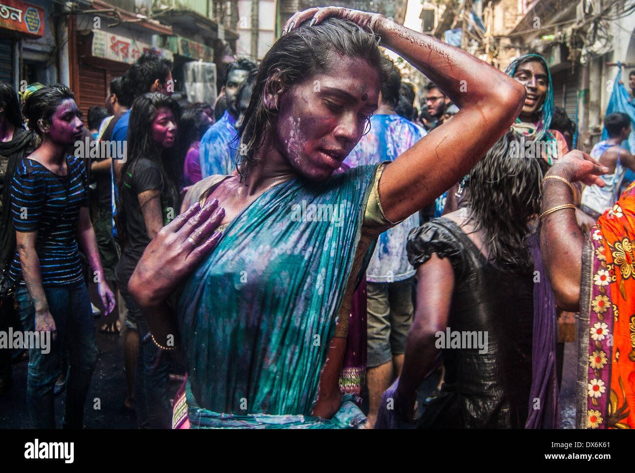 Dhaka, Bangladesh. 16th Mar, 2014. The colorful festival of Holi is celebrated on Phalgun Purnima which comes in February end or early March. Holi festival has an ancient origin and celebrates the triumph of 'good' over 'bad'. The colorful festival bridges the social gap and renew sweet relationships. On this day, people hug and wish each other 'Happy Holi'. In Bangladesh Holi is celebrated in Shakhari Bazar for many years. People from all religion and area come here to enjoy the day and to make the festival more colorful. © Anik Rahman/NurPhoto/ZUMAPRESS.com/Alamy Live News Stock Photo