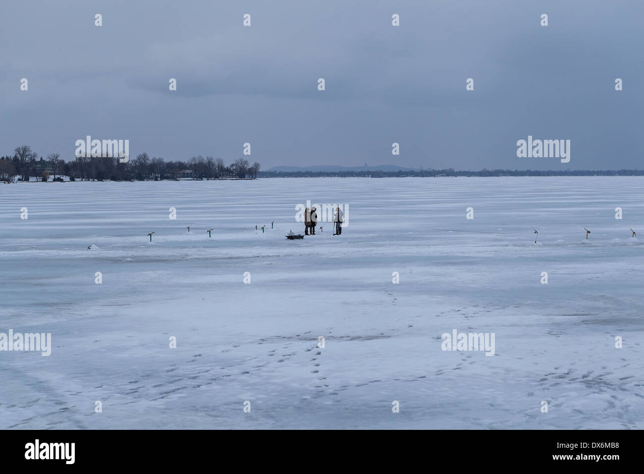 Ice fishing in frozen river hi-res stock photography and images