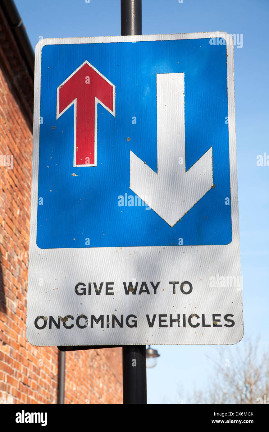 Road sign with arrows Give Way to Oncoming Vehicles, UK Stock Photo