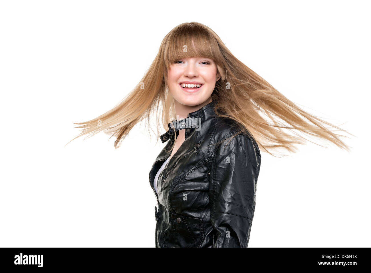 Blond girl with a black leather jacket and waving blond hair Stock Photo