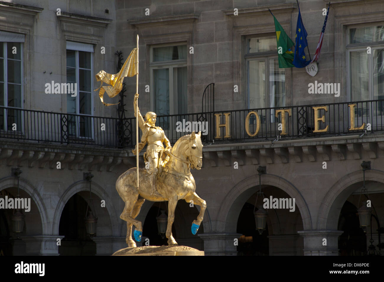 Jeanne d'Arc sculpture by Emmanuel Fremiet located at the Place des Pyramides with hotel Regina in background Stock Photo