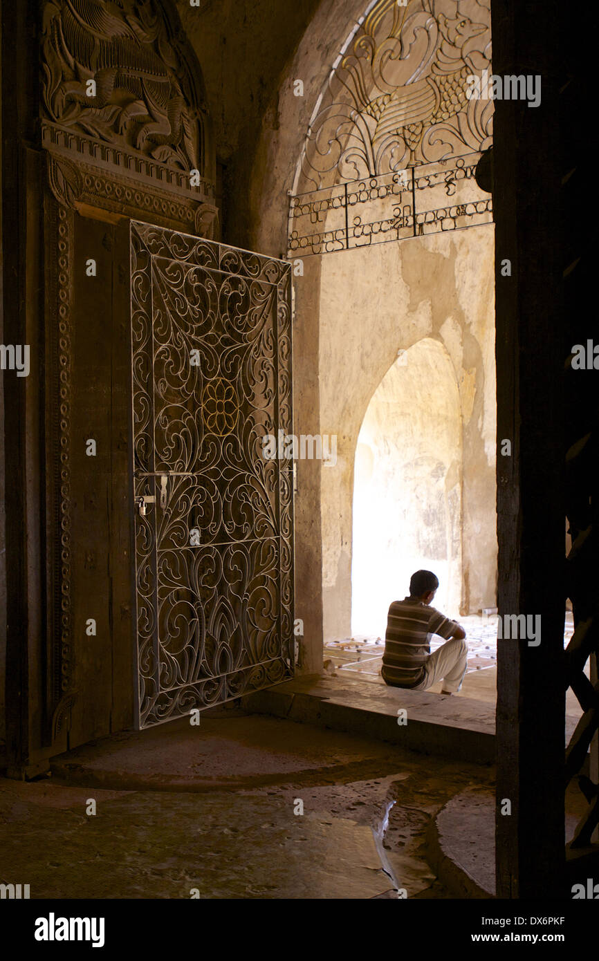 Entrance doorway with carved wooden doors & wrought iron gates leading