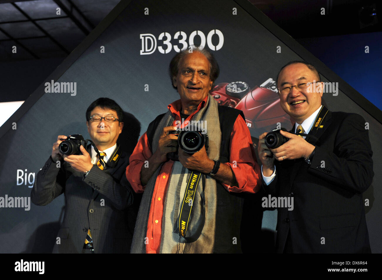 New Delhi, India. 19th Mar, 2014. Photographer Raghu Rai (C) and two senior officers of Nikon Corporation attend the launch ceremony of Nikon D4s and D3300 cameras in New Delhi, India, March 19, 2014. © Partha Sarkar/Xinhua/Alamy Live News Stock Photo