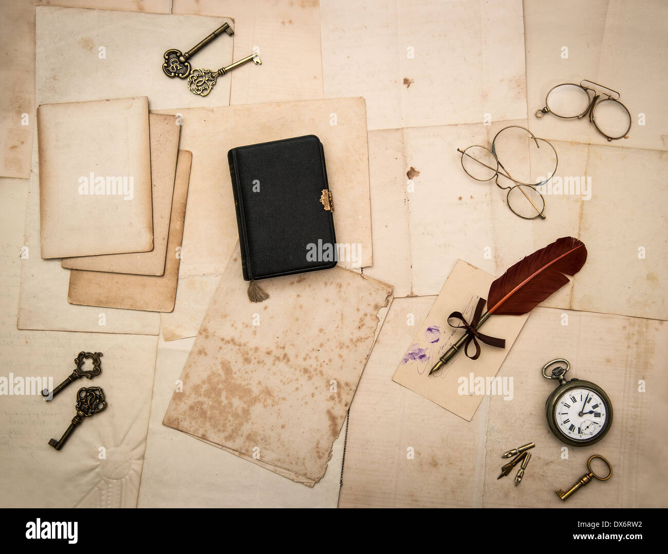 vintage things, glasses, keys, diary book, old letters and photos. nostalgic sentimental paper background Stock Photo