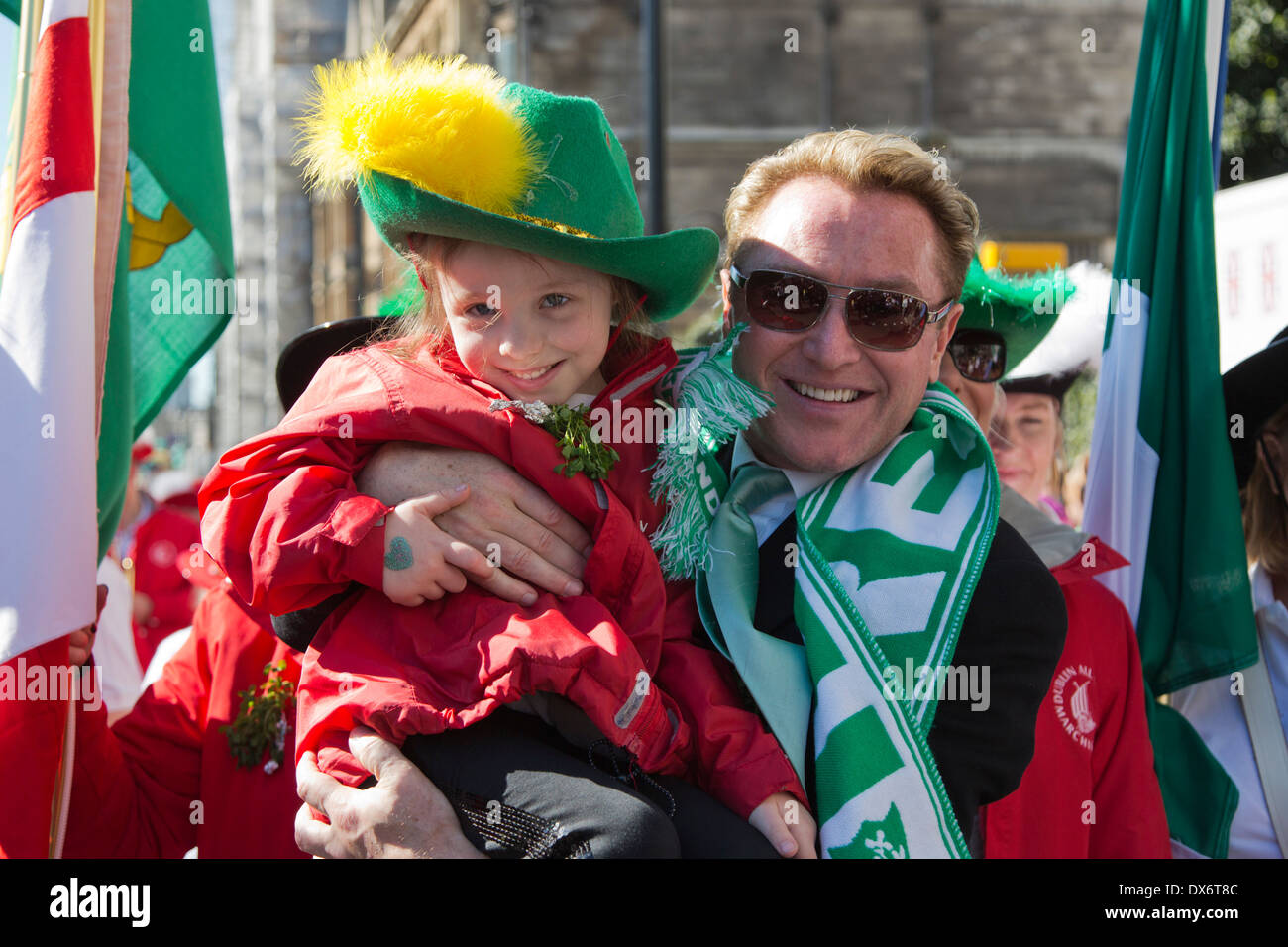 Irish-American Dance-Star Michael Flatley poses with little girl, 5 years. St Patrick's Day Parade London Stock Photo