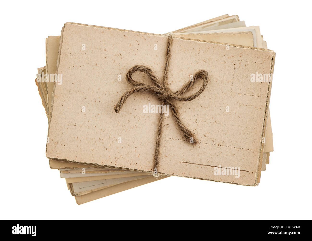 pile of old postcards isolated on white background. vintage paper sheets Stock Photo