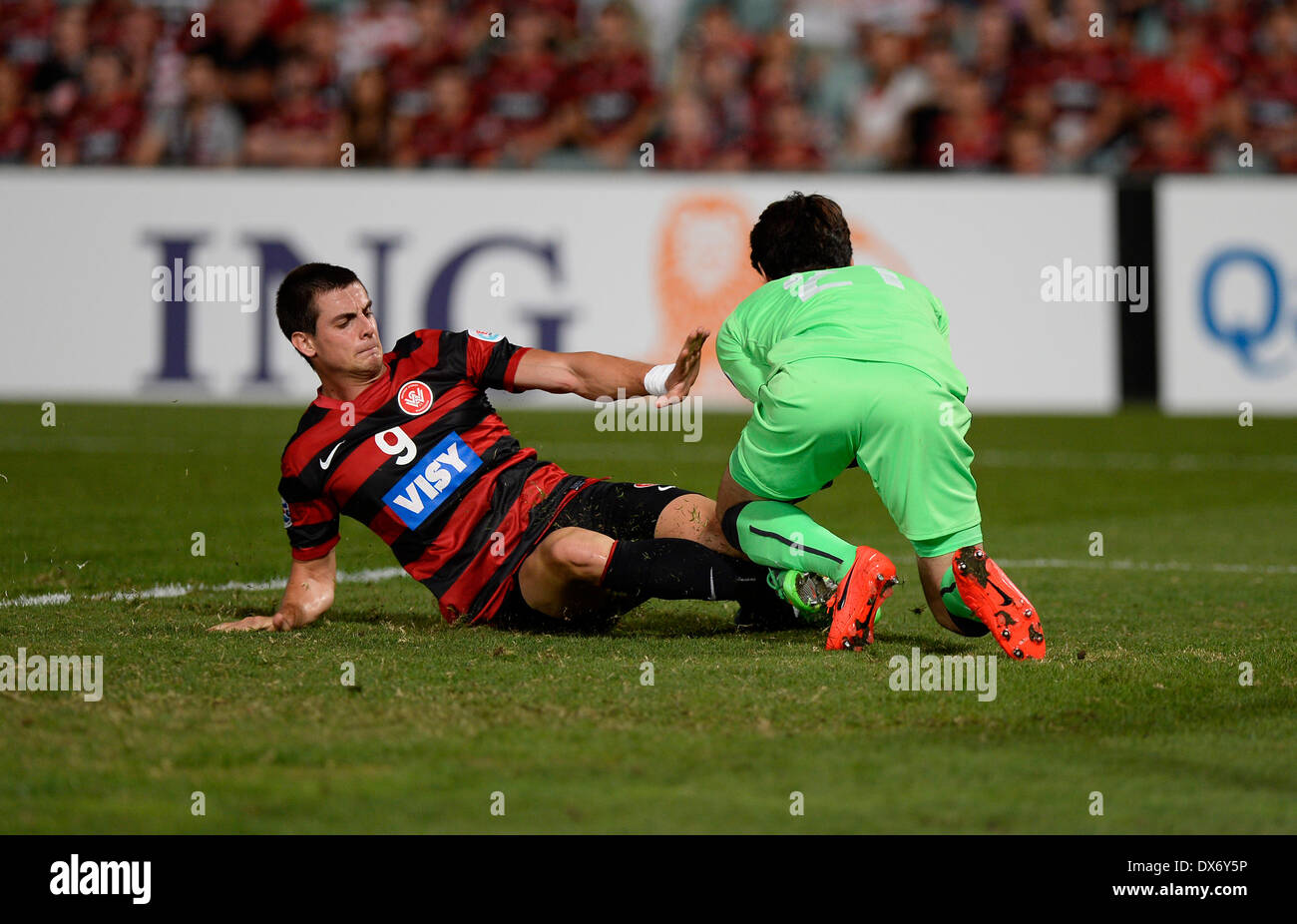 Sydney, Australia. 19th Mar, 2014. Wanderers forward Tomi Juric and Kawasaki goalkeeper Yohei Nishibe in action during the AFC Champions League game between Western Sydney Wanderers FC and Kawasaki Frontale FC of Japan from the Pirtek Stadium, Parramatta. Wanderers won 1-0. Credit:  Action Plus Sports/Alamy Live News Stock Photo