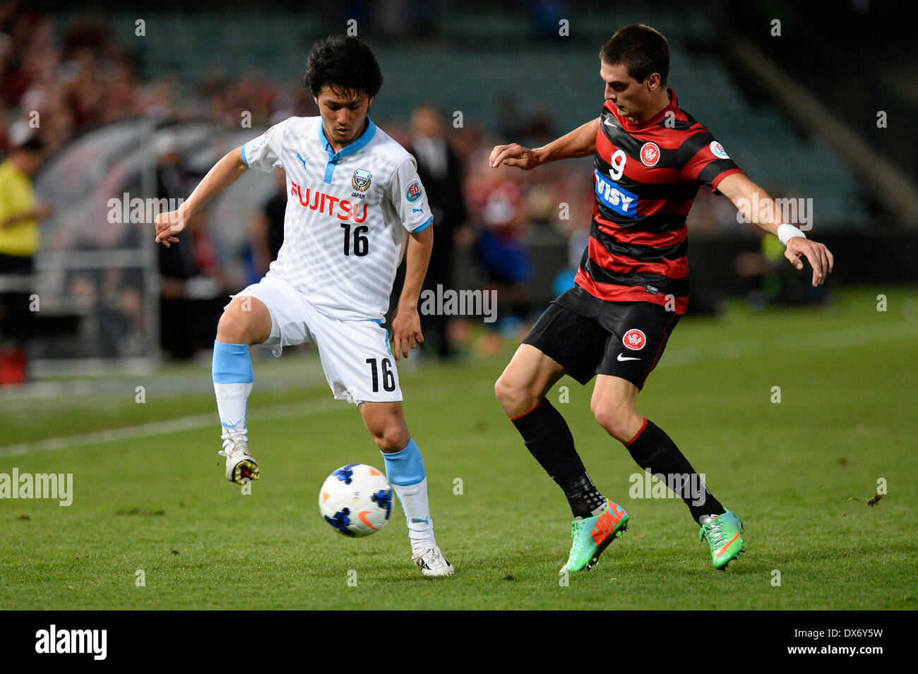 Sydney, Australia. 19th Mar, 2014. Kawasaki midfielder Ryota Oshima and Wanderers forward Tomi Juric in action during the AFC Champions League game between Western Sydney Wanderers FC and Kawasaki Frontale FC of Japan from the Pirtek Stadium, Parramatta. Wanderers won 1-0. Credit:  Action Plus Sports/Alamy Live News Stock Photo