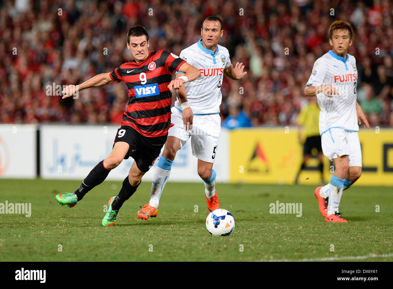 Sydney, Australia. 19th Mar, 2014. Wanderers forward Tomi Juric and Kawasaki defender Jeci in action during the AFC Champions League game between Western Sydney Wanderers FC and Kawasaki Frontale FC of Japan from the Pirtek Stadium, Parramatta. Wanderers won 1-0. Credit:  Action Plus Sports/Alamy Live News Stock Photo