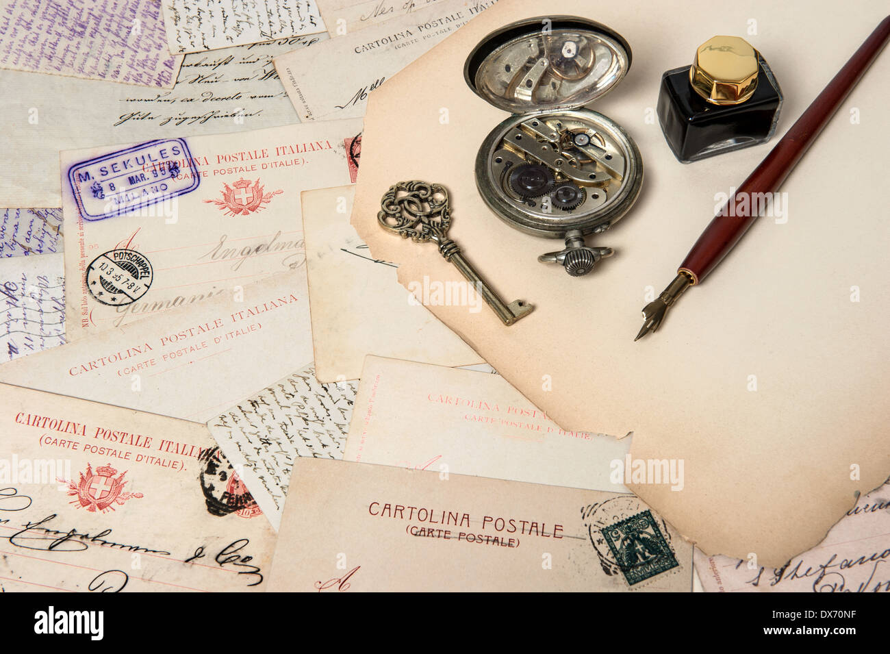 vintage accessories, antique ink pen, key, clock, old postcards and letters. scrapbook paper background Stock Photo