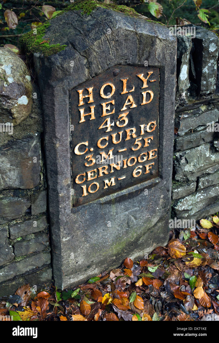 Photograph of ancient road signpost milestone in furlongs, at Betws y