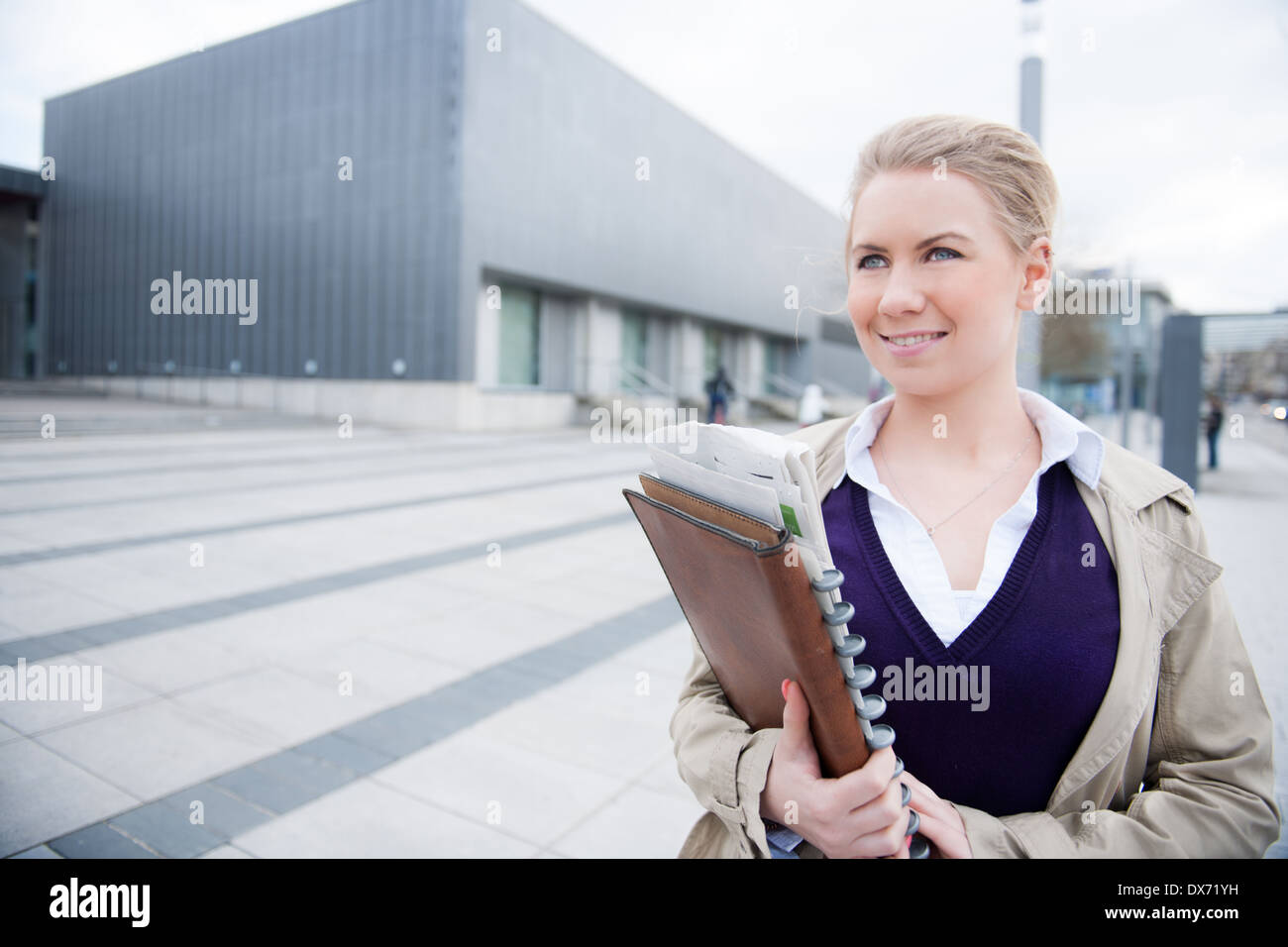 Woman on street documents hi-res stock photography and images - Alamy